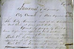 Image of a historic handwritten city council meeting minutes.