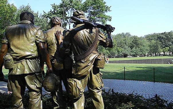 Image of 'The Three Soldiers' bronze statue by Frederick Hart displayed in the National Mall in Washington DC.