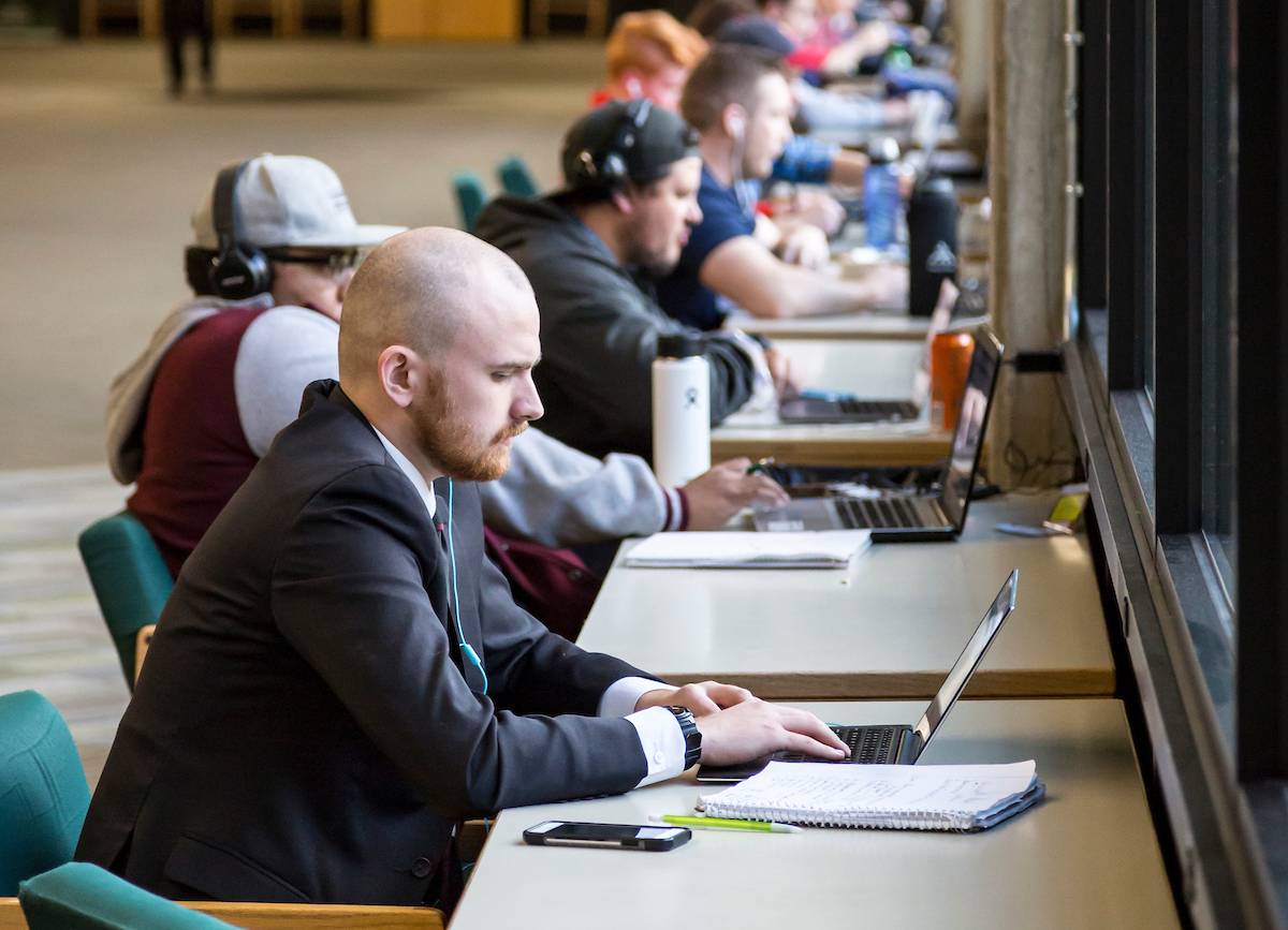 student studying on campus