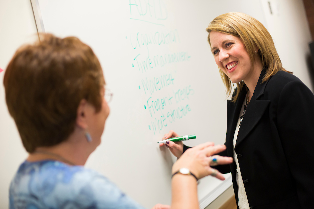 Teacher working with students