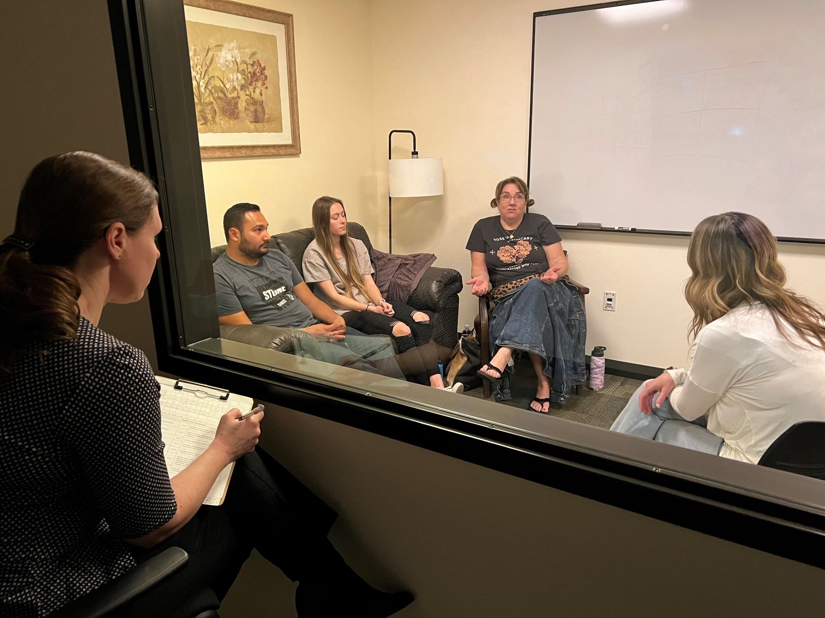 Therapist with 3 clients being observed