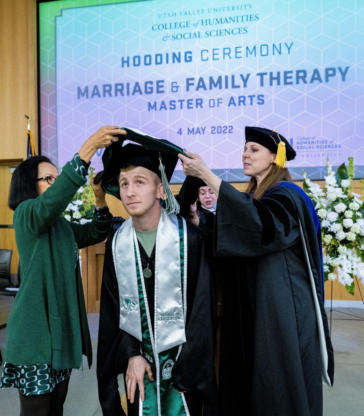 Male graduate being hooded