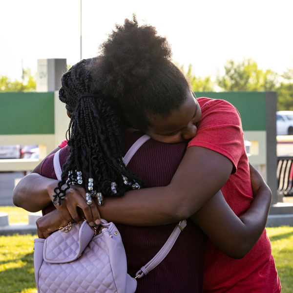 Two black UVU students embracing