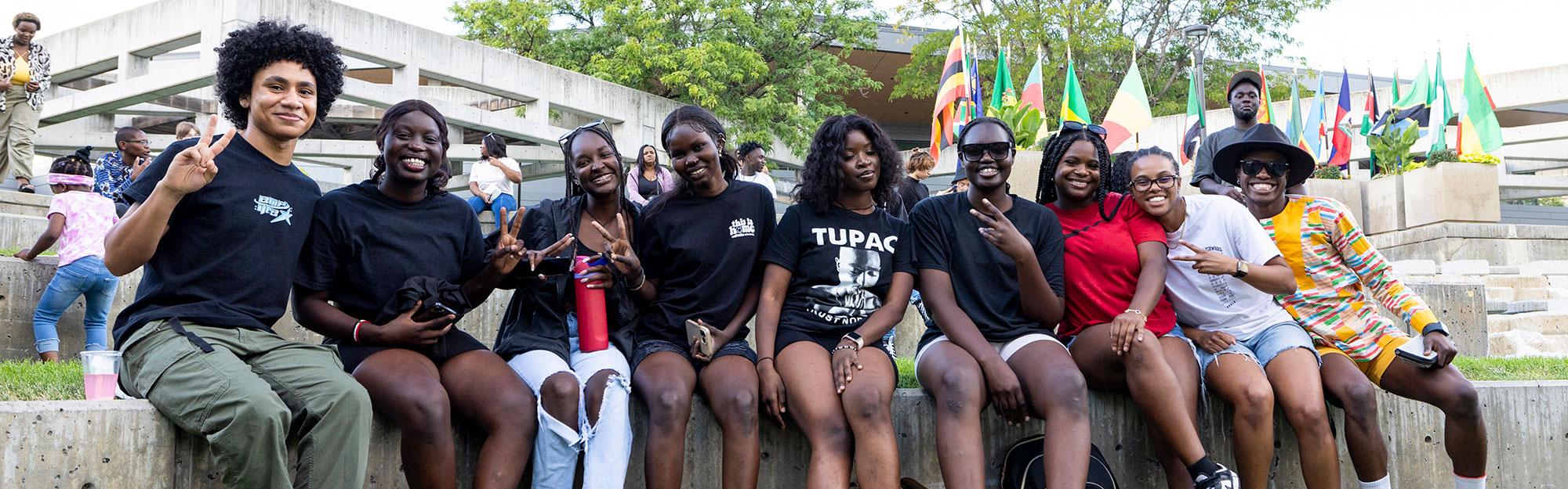 A group of ten black UVU students posing together on campus