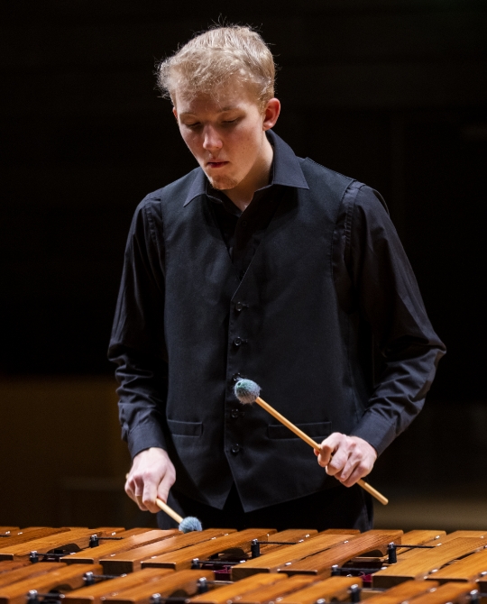 Student playing marimba - decorative image