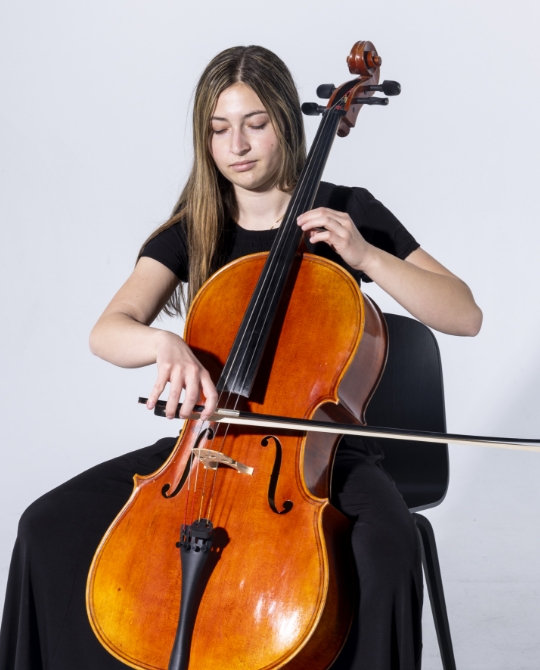 Student playing cello - decorative image