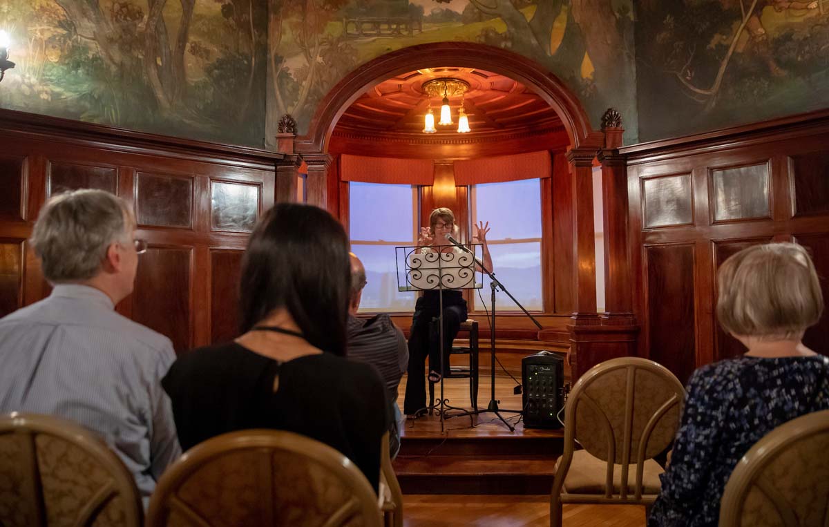 UVU professor and actor Kim Abunuwara performing a dramatic reading from Dickens’ works.