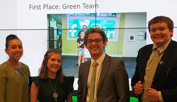 The winning Green Team from the compentition pose for a photo.