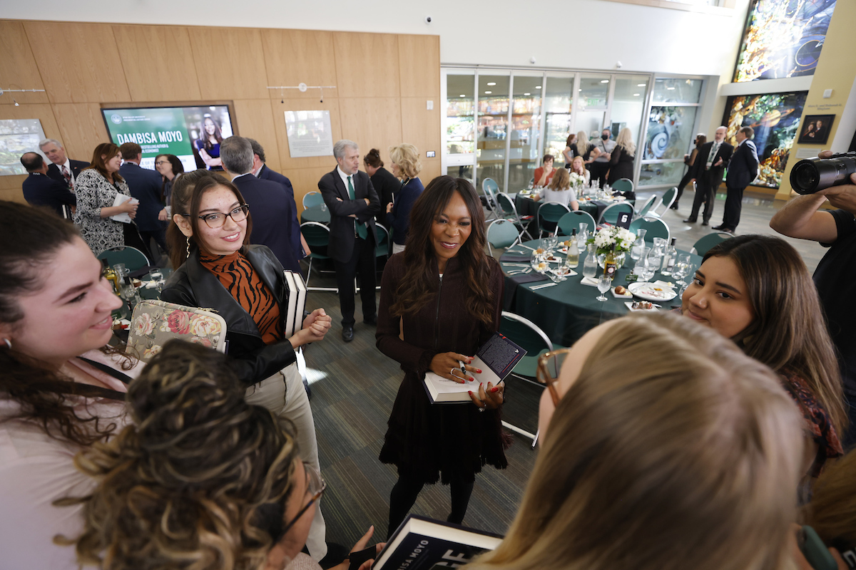 Dr. Dambisa Moyo interacts with attendees