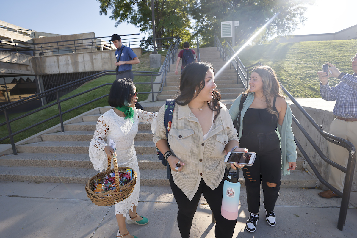 President Tuminez handing out snacks to students