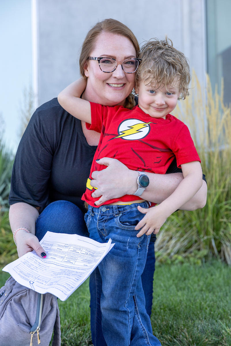 Jennifer D'Haenens with her four-year-old son outside the Wee Care Center at UVU.