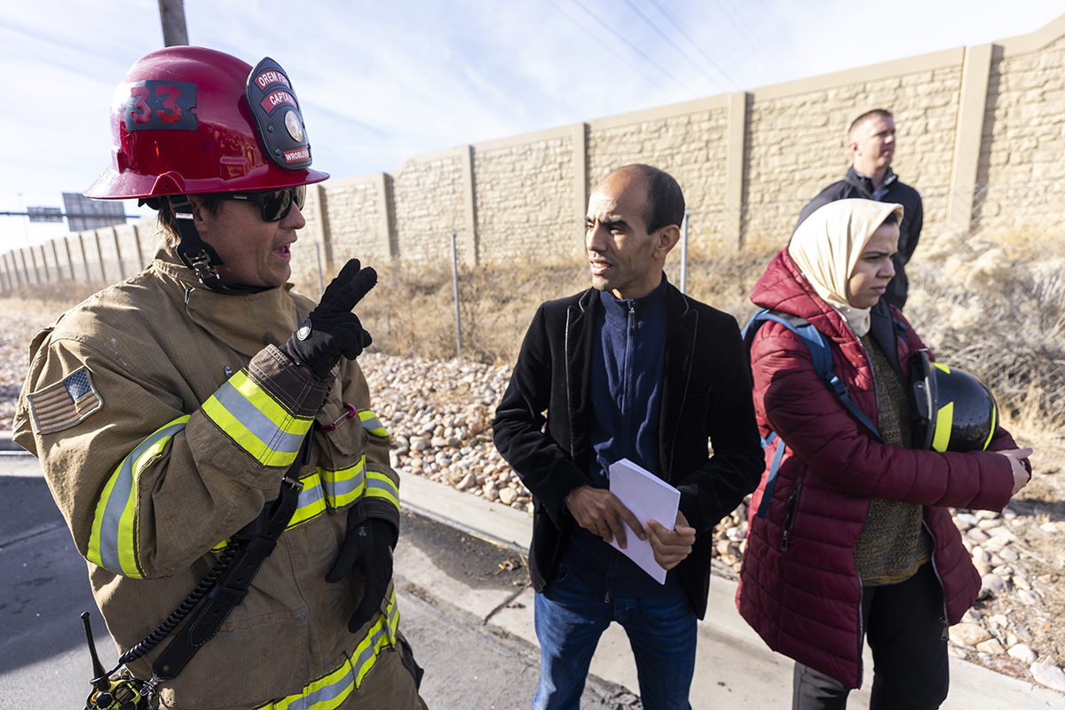 Kamal Azzaoui, Commander of the Morocco Civil Protection, speaks with a Station 33 firefighter. 