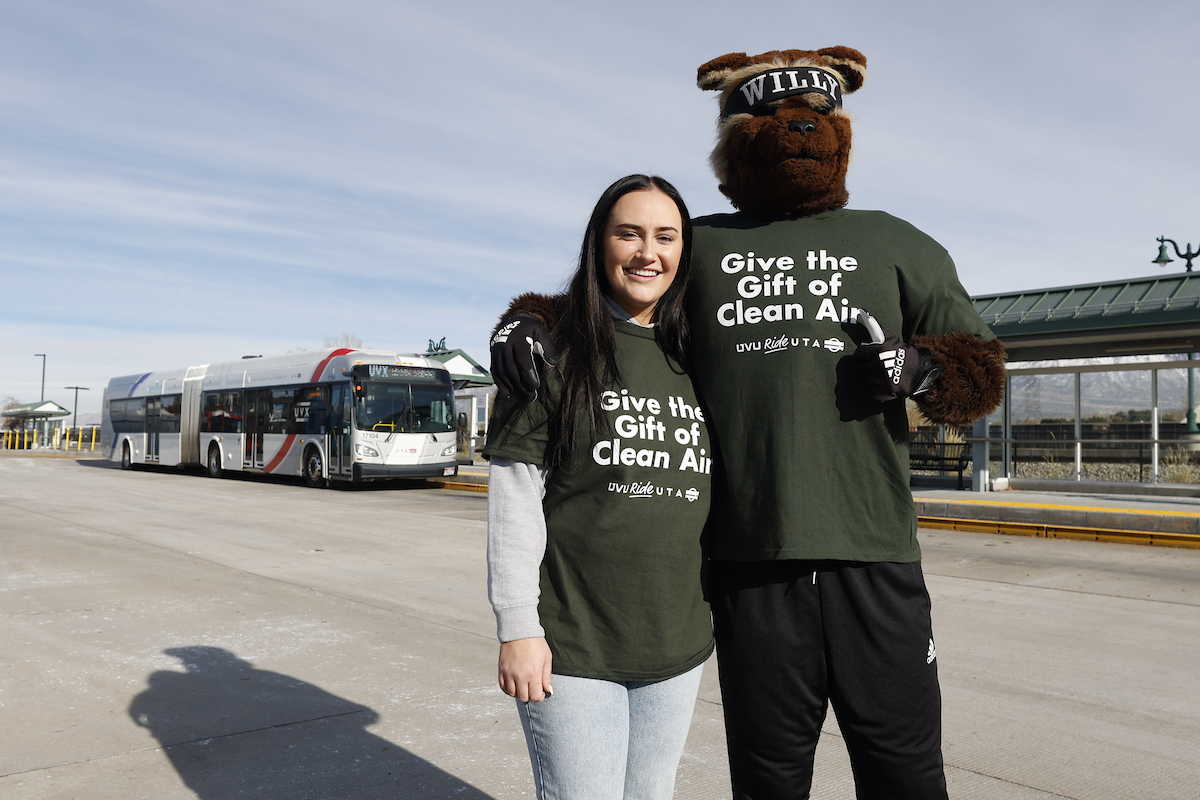 Caitlin Bennet poses with Willy the Wolverine at Clean Air campaign press conference