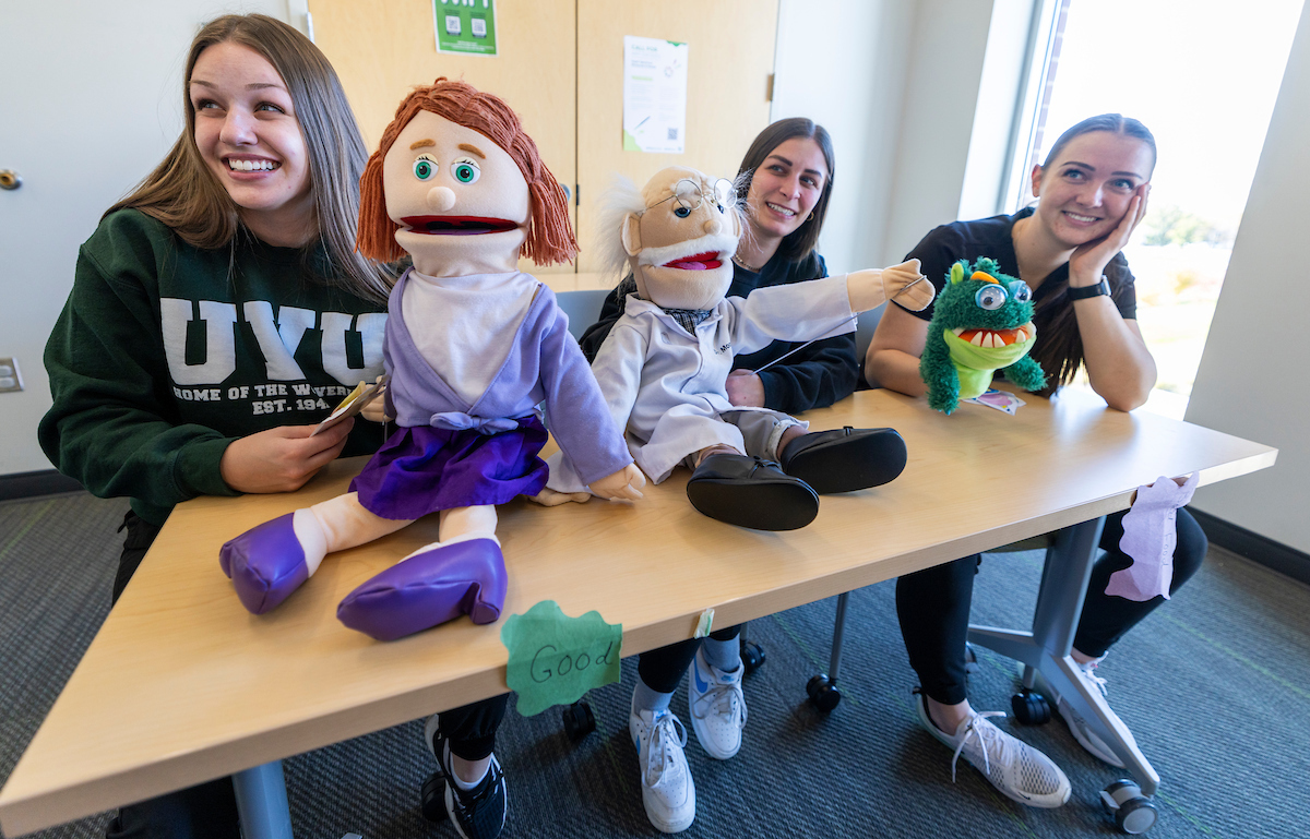 UVU students use puppets to help teach dental hygiene.