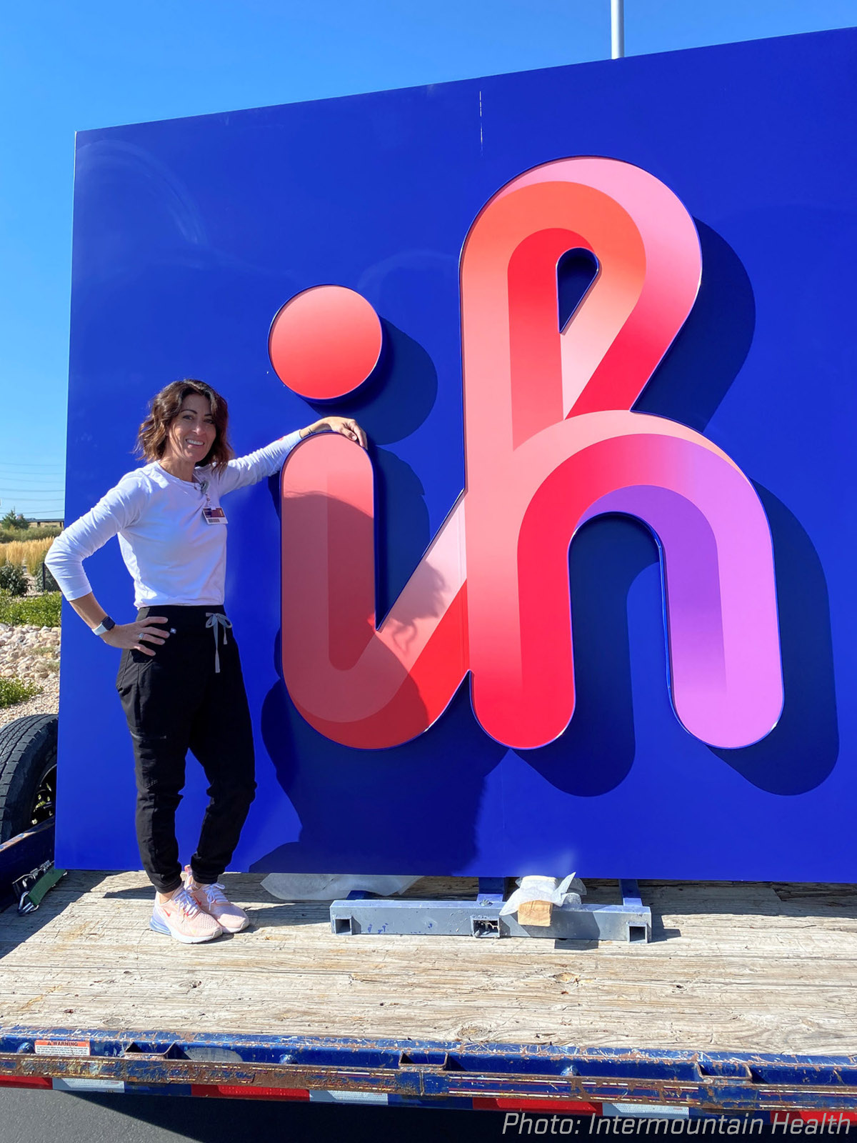 Megan Johnson poses in front of the Intermountain Health sign Megan Johnson poses in front of the Intermountain Health sign