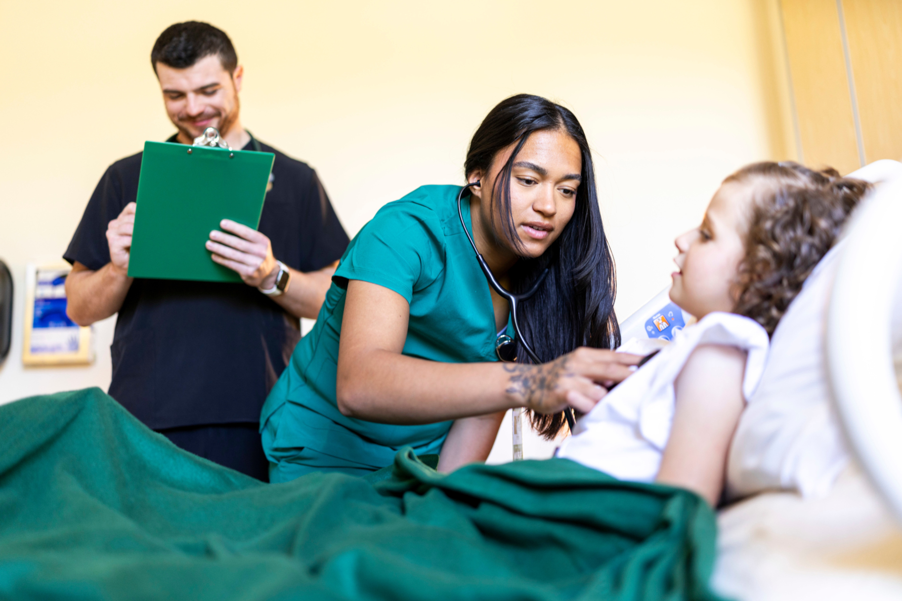 nurses examine a young girl