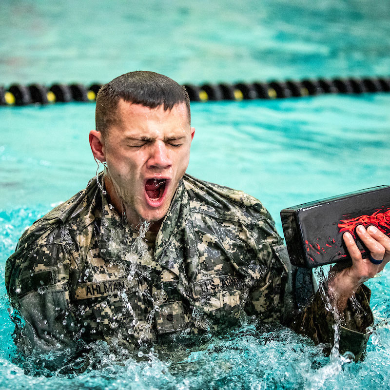 ROTC member dives for brick