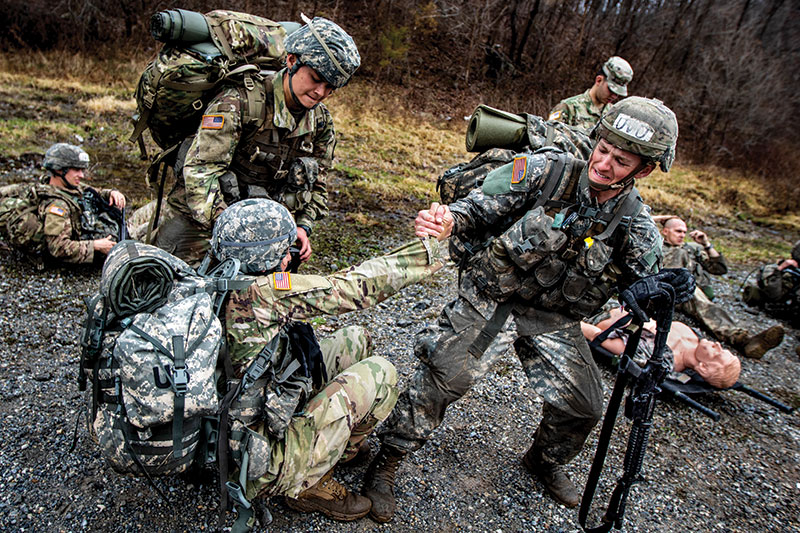 Helping a team member up off the ground.