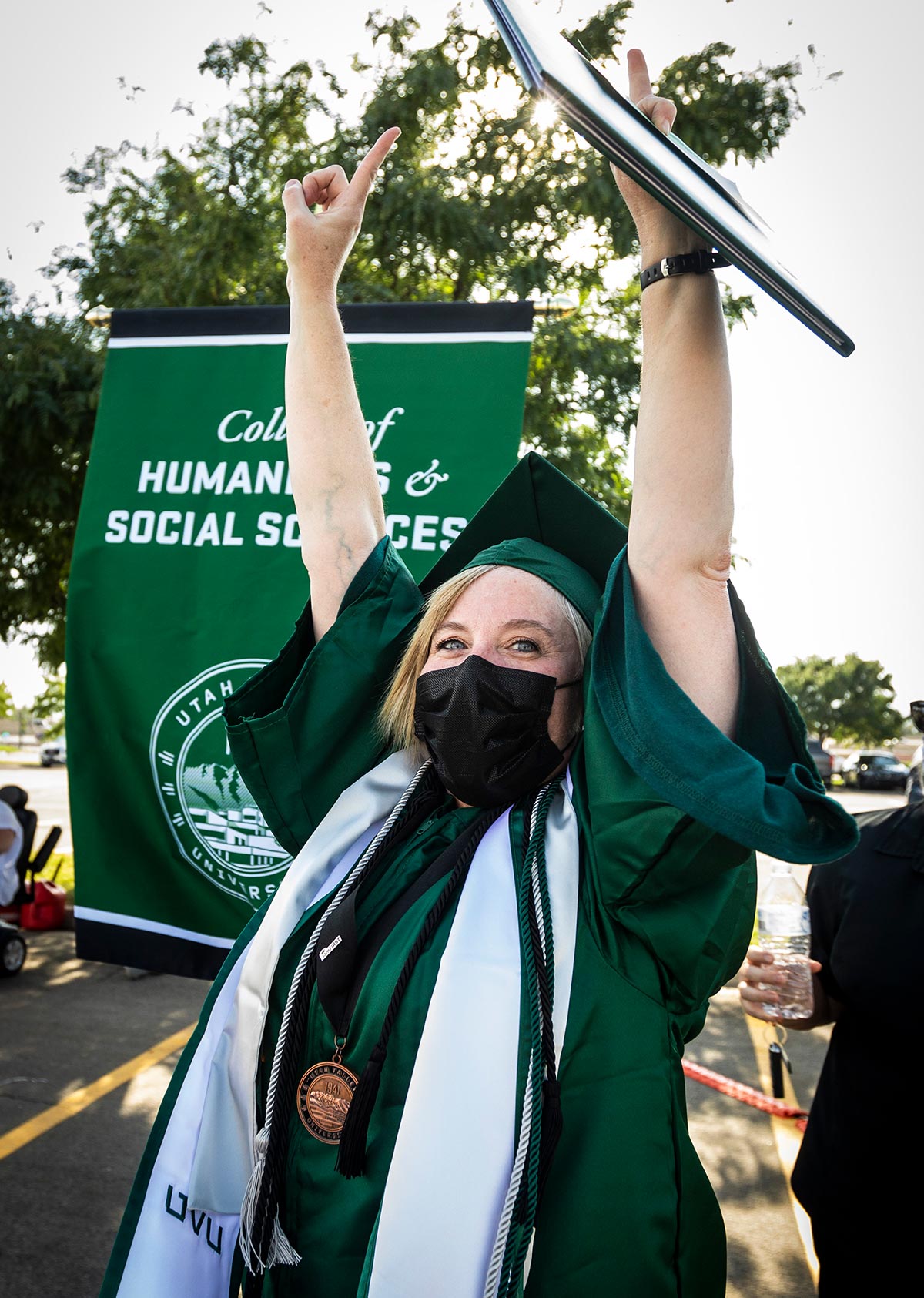 Graduate Candida poses triumphant