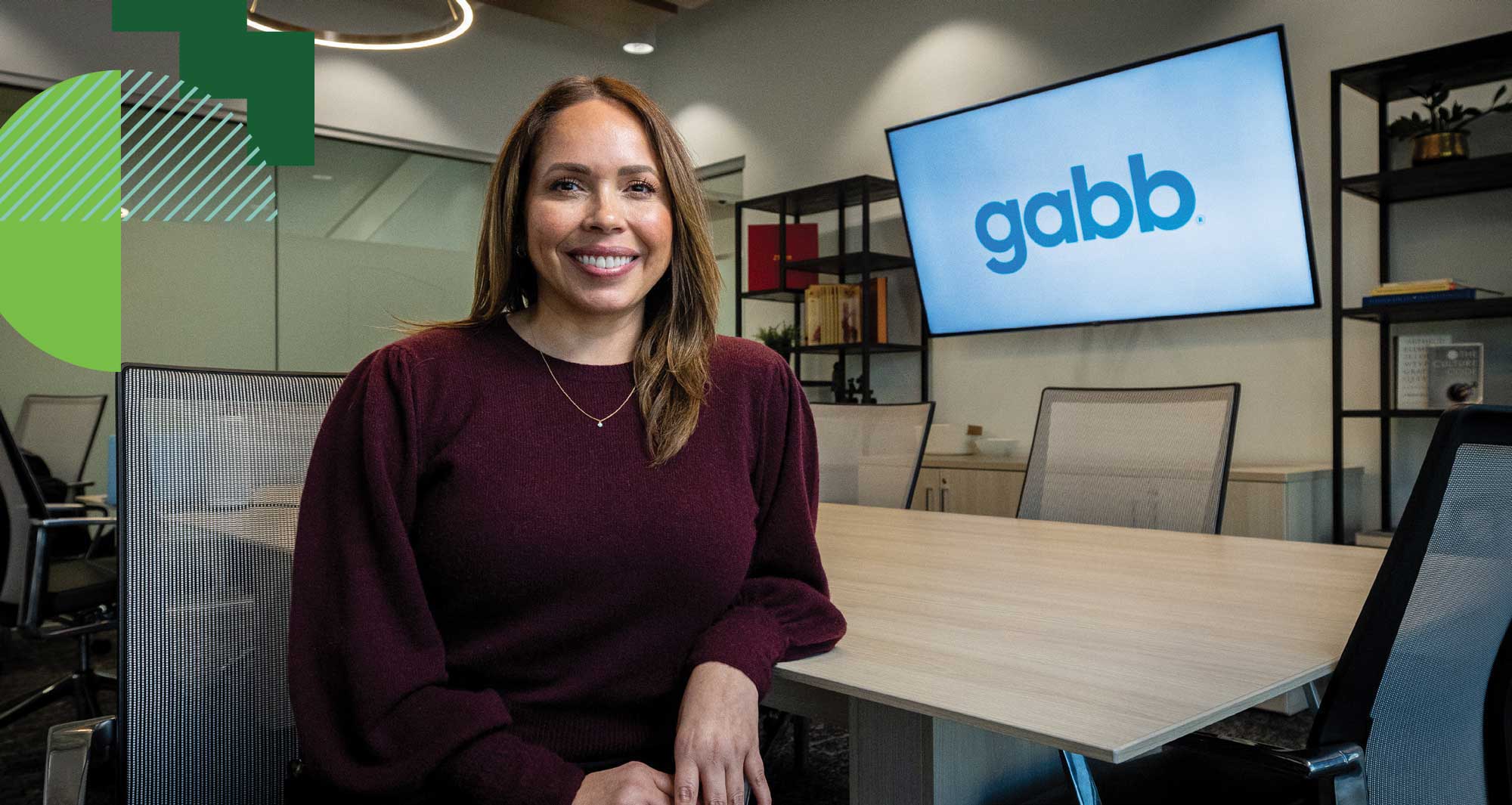 Diane Aceveda poses at a meeting table