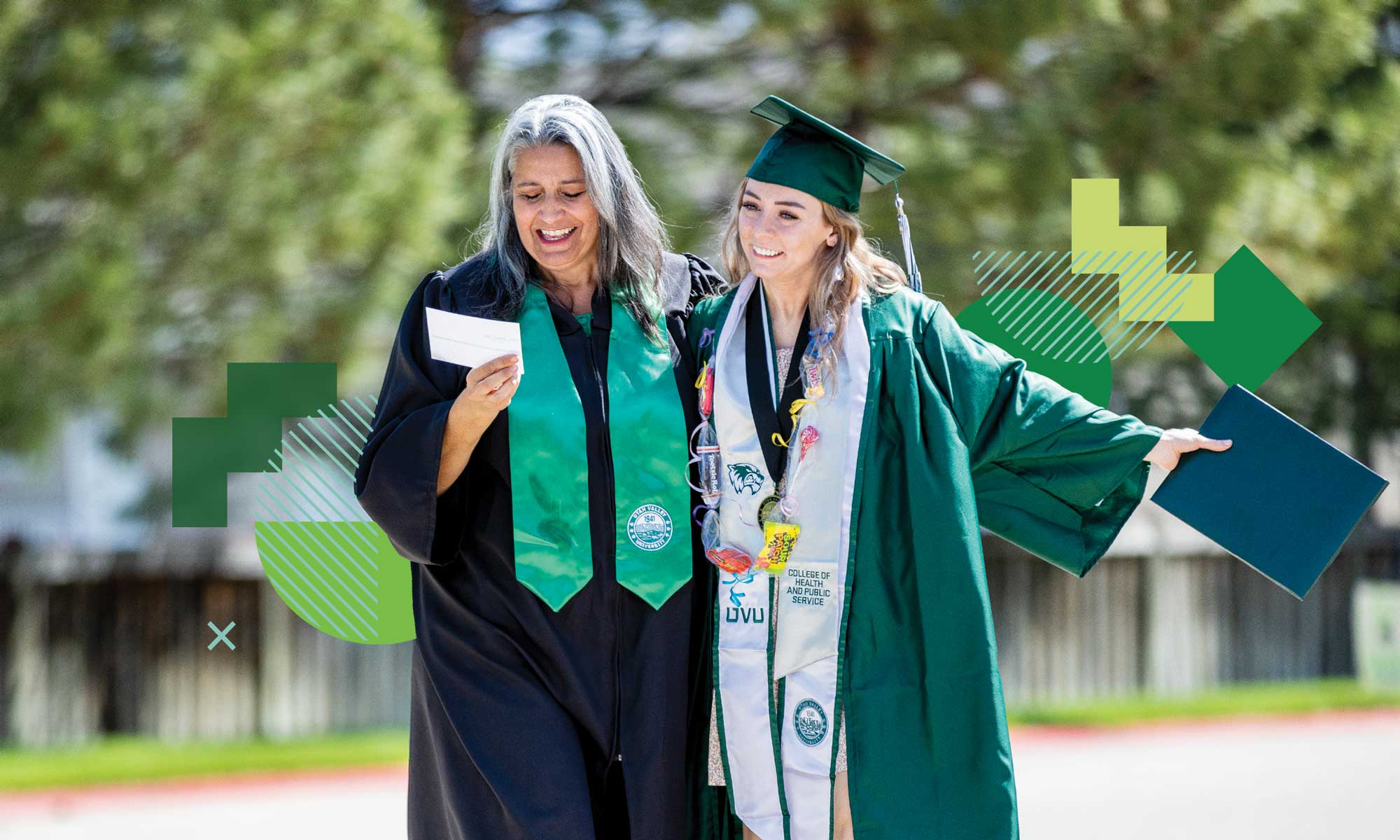 Graduate celebrates with mentor.