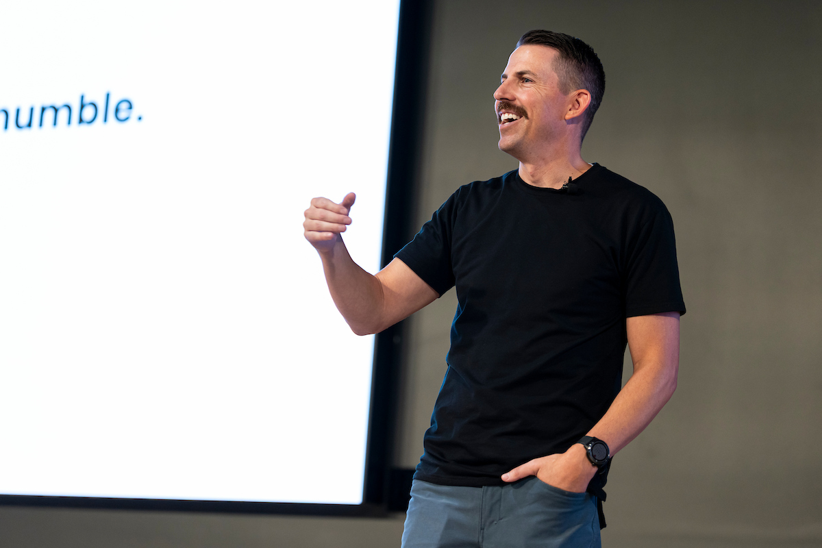 Taylor Napierski laughs while sharing stories from his career during his Halladay Lecture Series lecture.