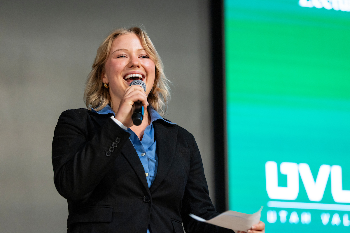 Jenna Smith, president of PFPSA 2025, speaks in front of a crowd.