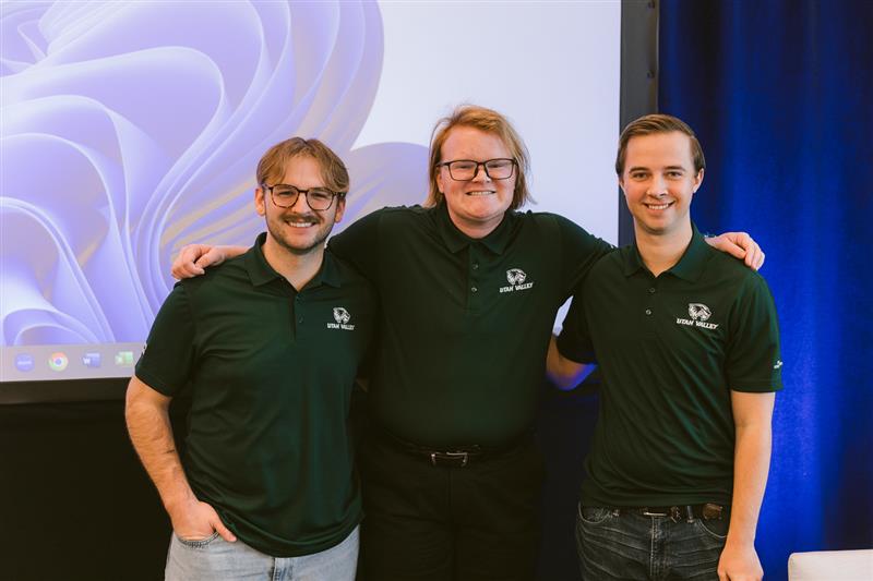 UVU's winning AFCPE Knowledge Bowl team with arms around each other.