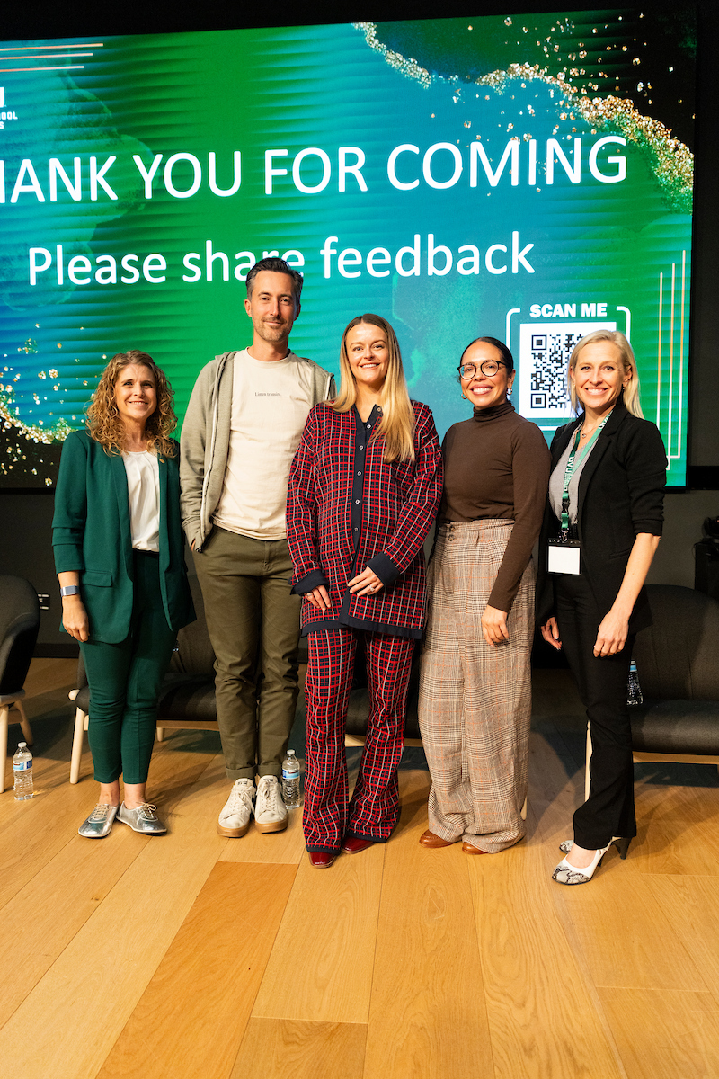 Five RISE conference speakers standing together in front of a large screen displaying a thank-you message.