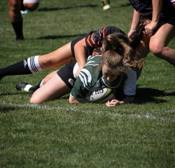 Anna Tibbitts playing rugby