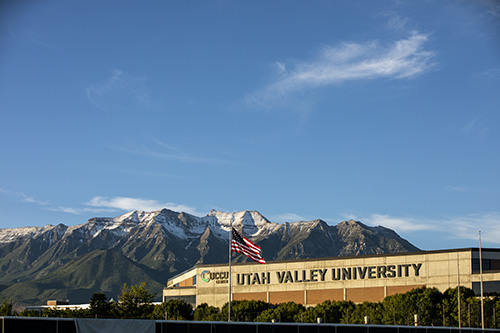Utah Valley University signage on building with mountain in the background