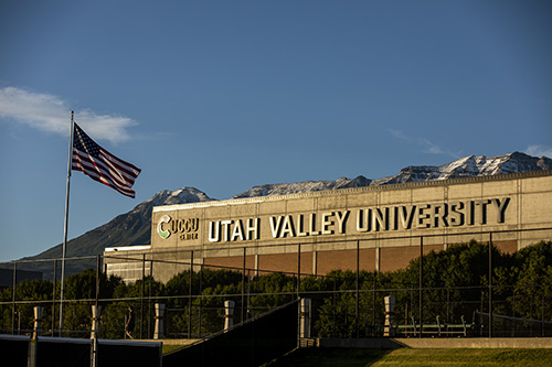 Utah Valley University signage on building with mountain in the background