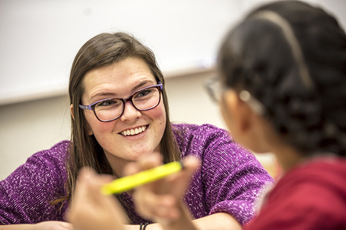 A teacher talking with a student