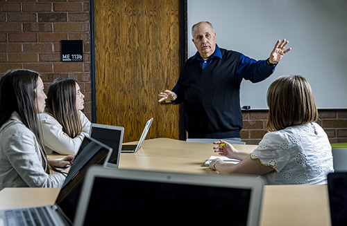 A teacher instructing students