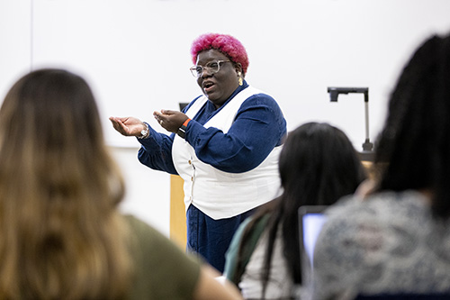 Teacher instructing a class of students