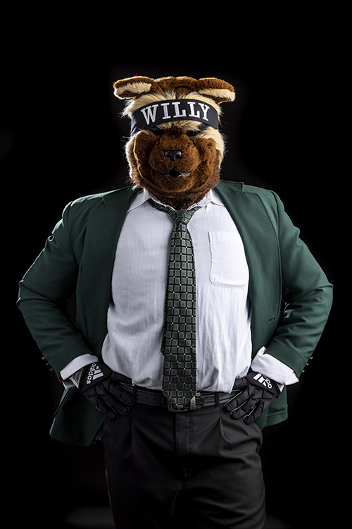 Willy the Wolverine wearing a green sports jacket