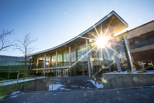 Sunshine backlighting the Noorda Center building.