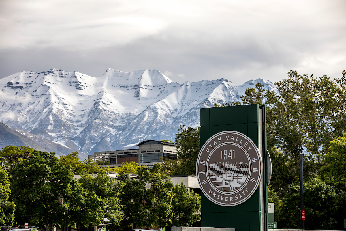 University seal sign at Utah Valley University entrance.