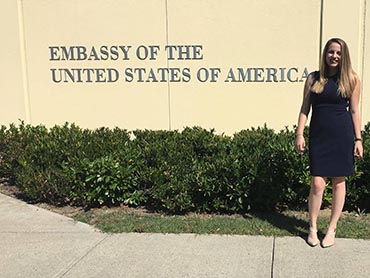 Savannah Mork in front of US Embassy