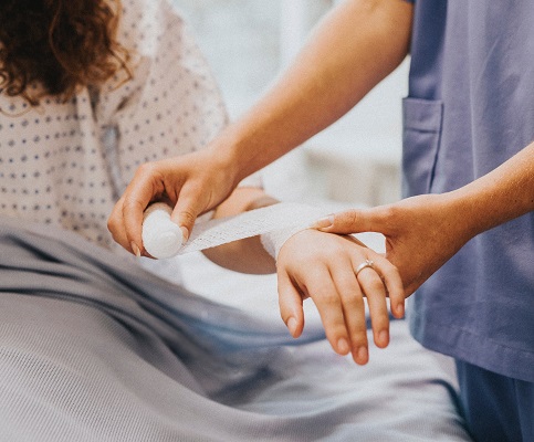 wrapping an arm with gauze