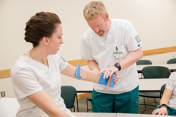 Man wraps a womans arm