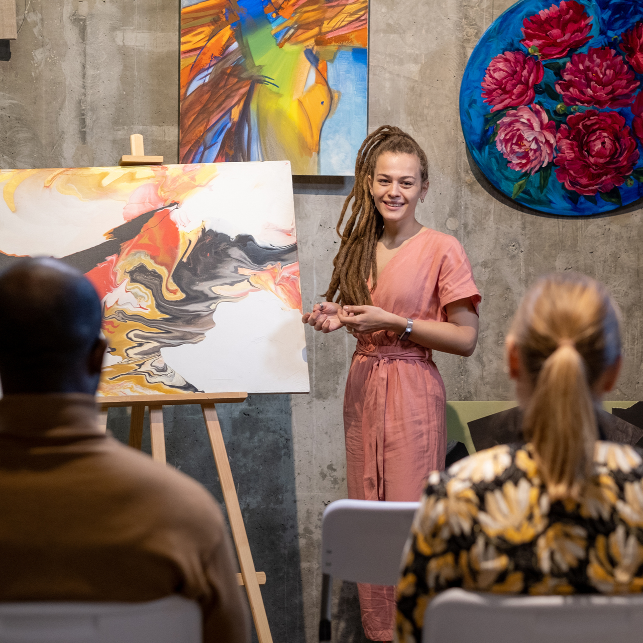 person standing in front of a painting