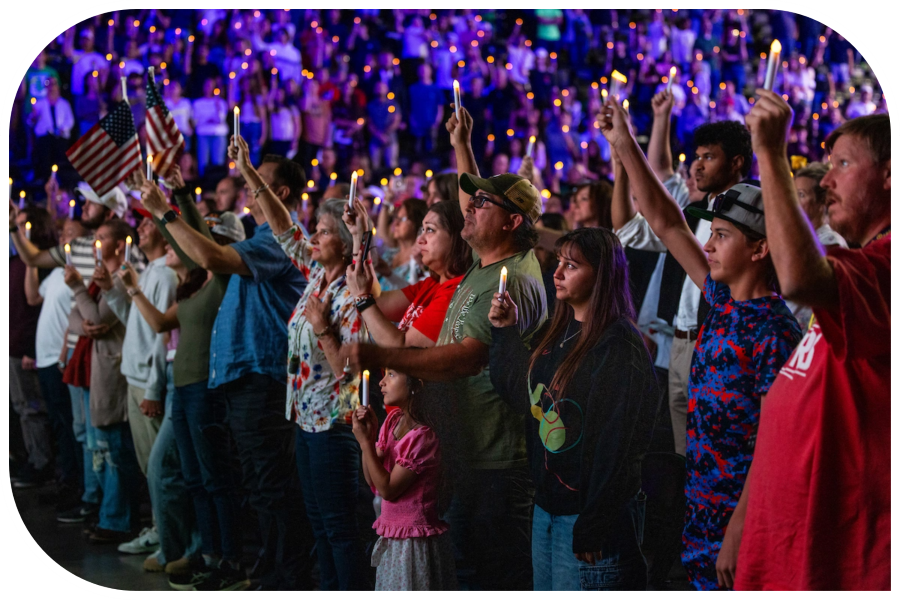 Group of people holding up a candle