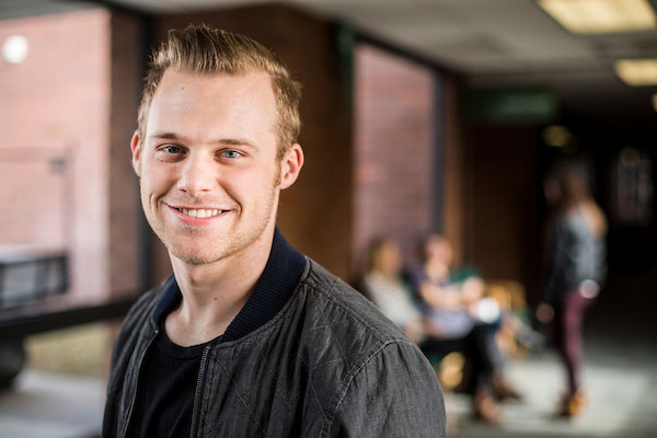 student standing in hall