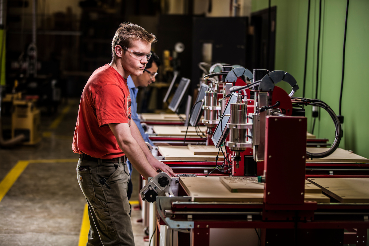 person working on machinery