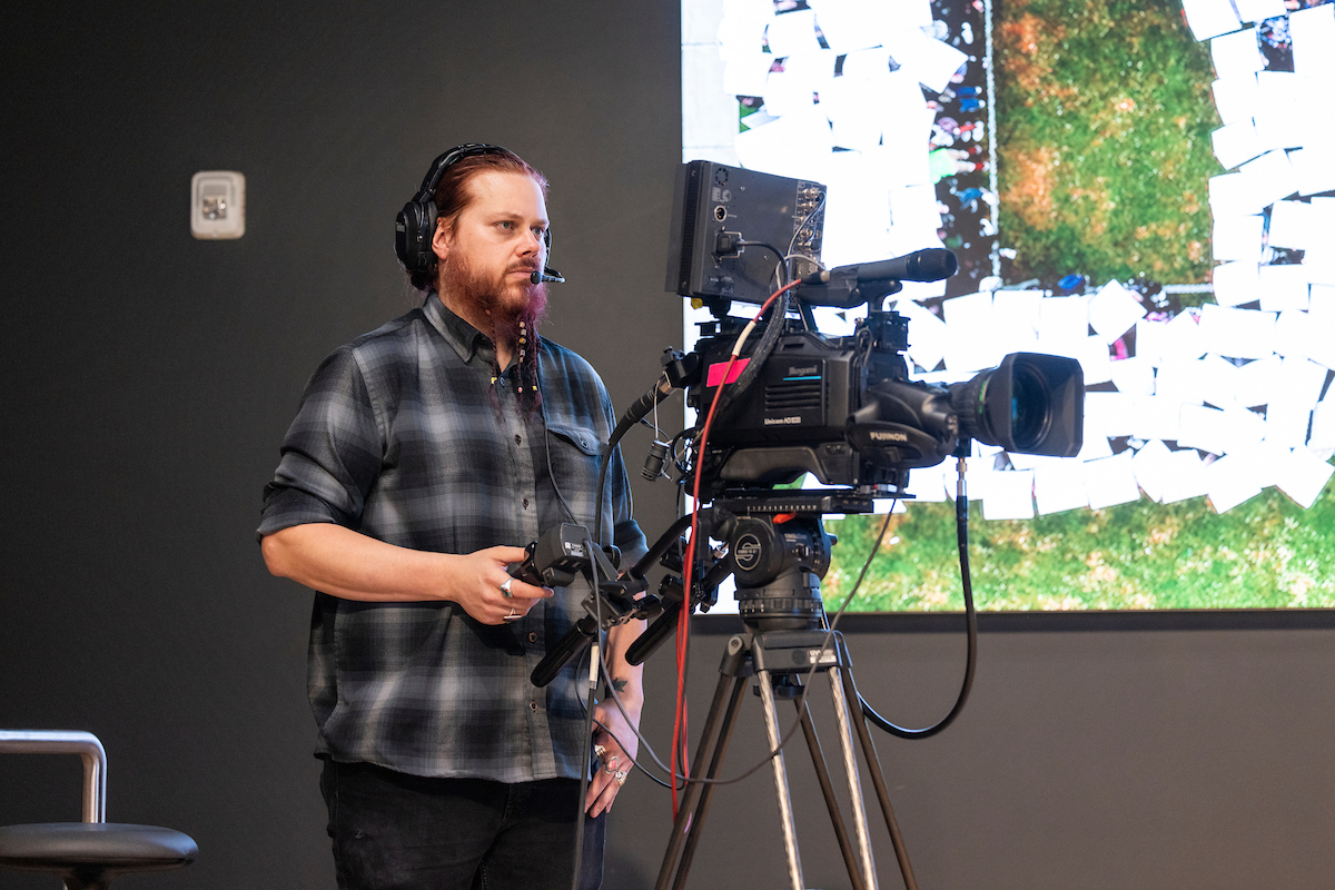 person behind a video camera