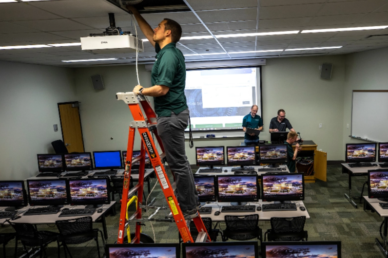 Technician working on equipment installation.