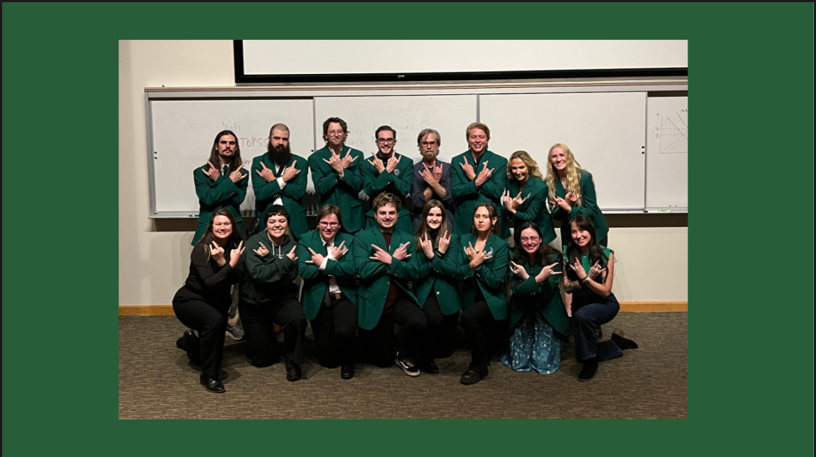 Team photo in green blasers