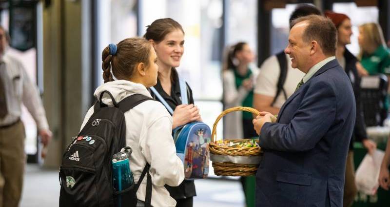 Interim President Wayne Vaught greets students on the first day the fall semester.
