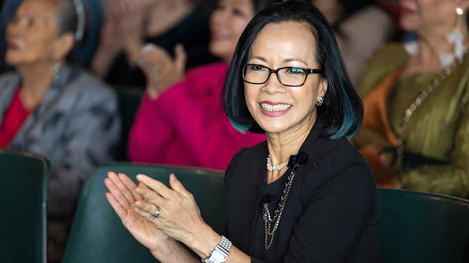 President Tuminez clapping her hands in applause